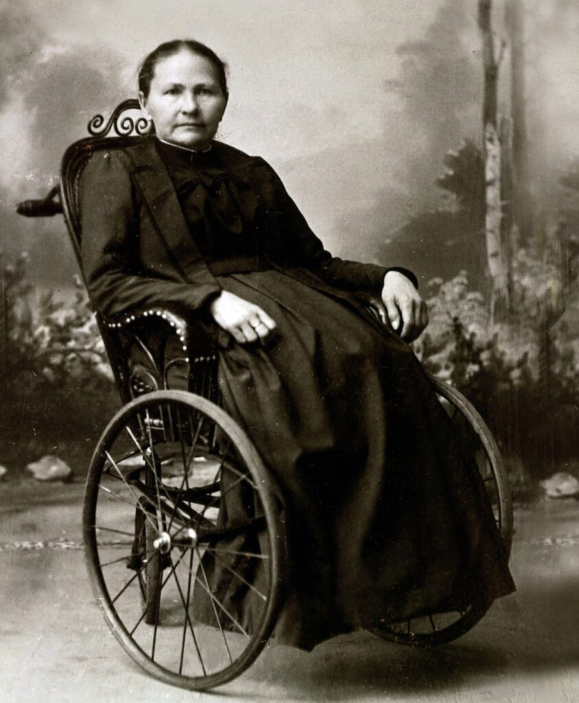 Portrait photograph of Margarete Steiff seated in a wheelchair, wearing a dark dress