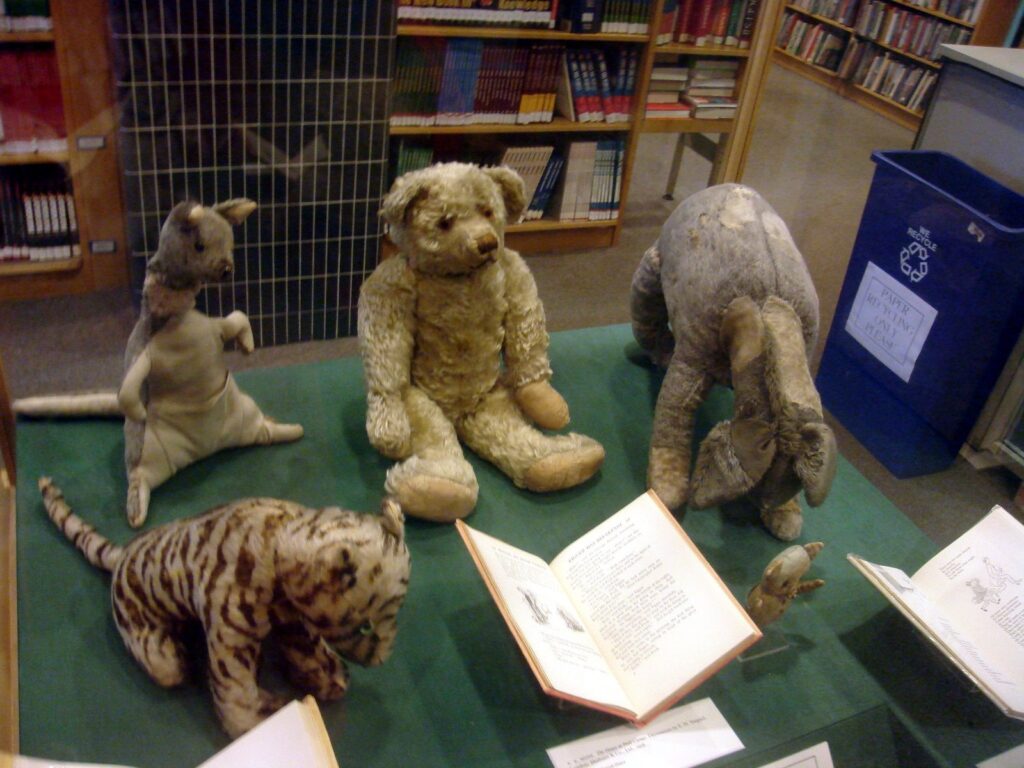 The original Winnie-the-Pooh, Eeyore, Piglet, Kanga and Tigger stuffed toys displayed in a glass case in New York